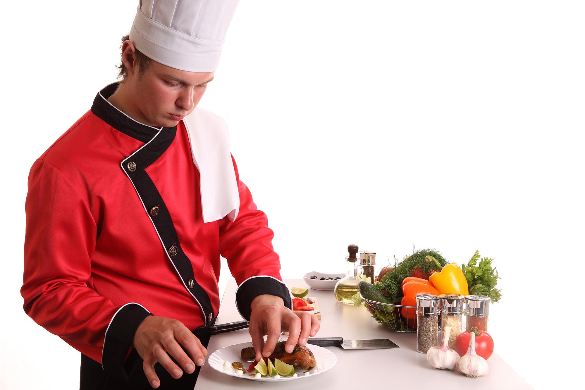 Studio chef demonstrating a quick sauté technique